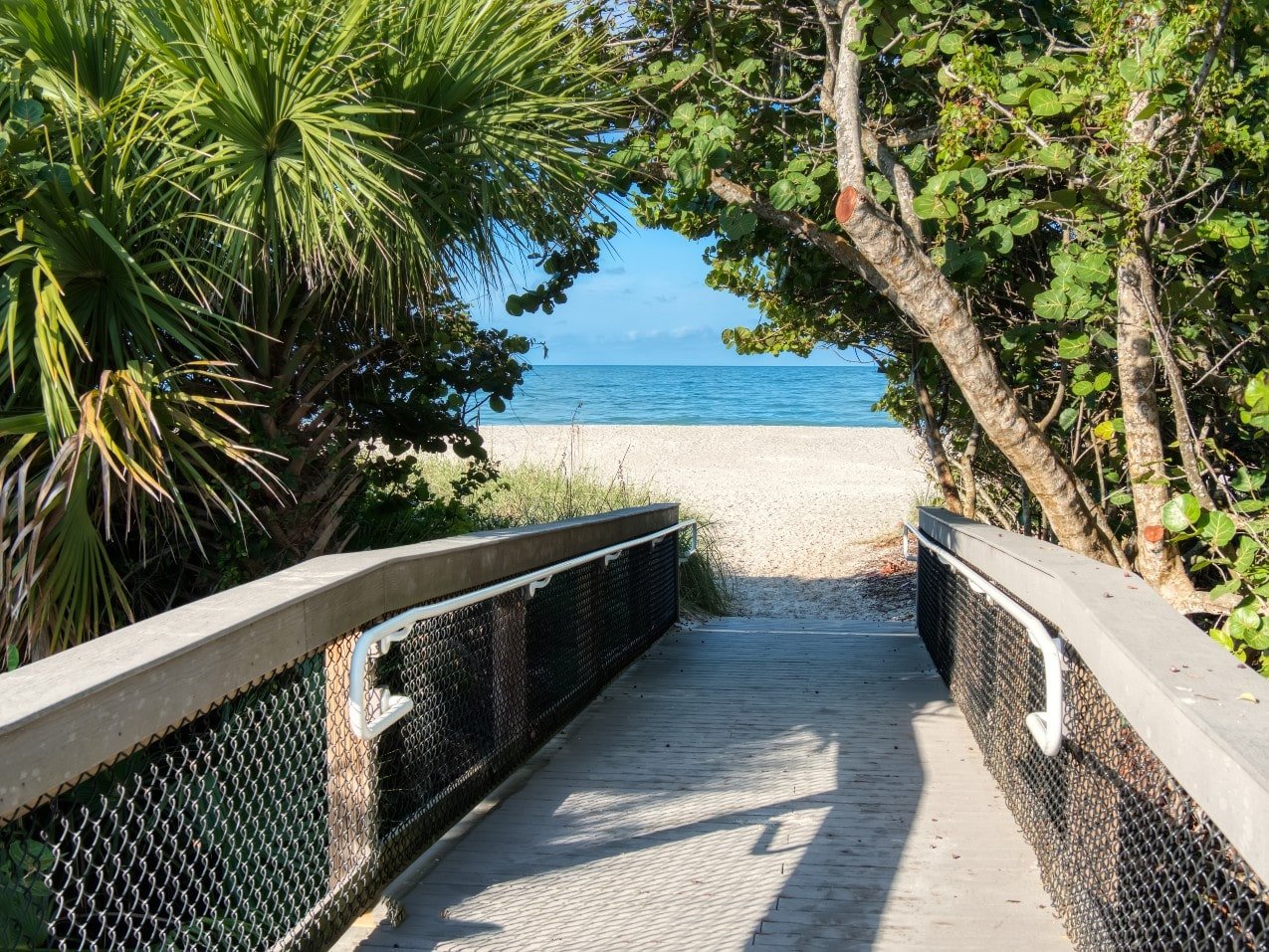Boardwalk leading to white sand beach in Nokomis, Florida